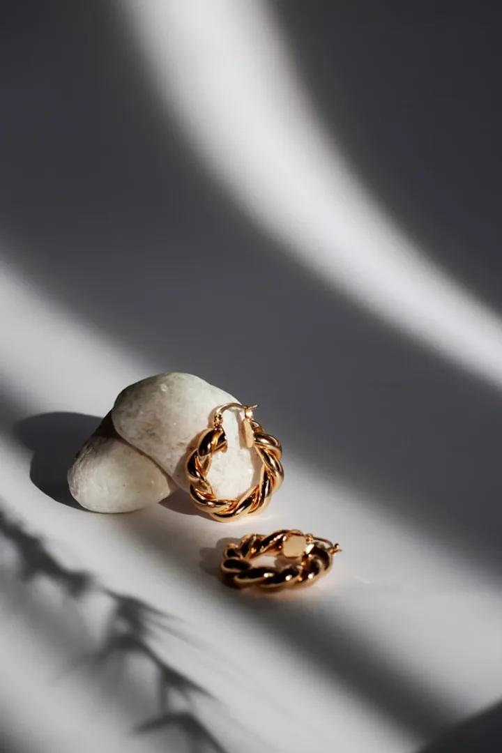 Gold jewellery on a soft-lit surface